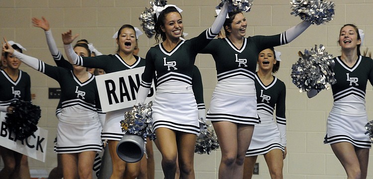 Co-captain Marina Masterson led the Lakewood Ranch varsity cheerleading squad out onto the floor.