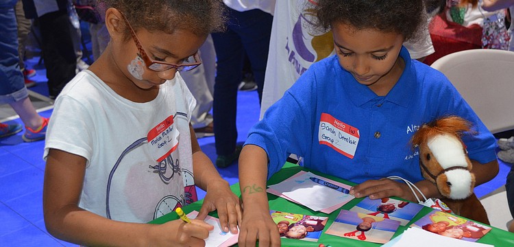 Mariah McMiller and Sarah Demlak decorate cards.
