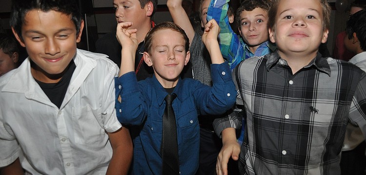 (Front) Nicholas Colacci, Dylan Bennett and Cade Saalmann felt the music.