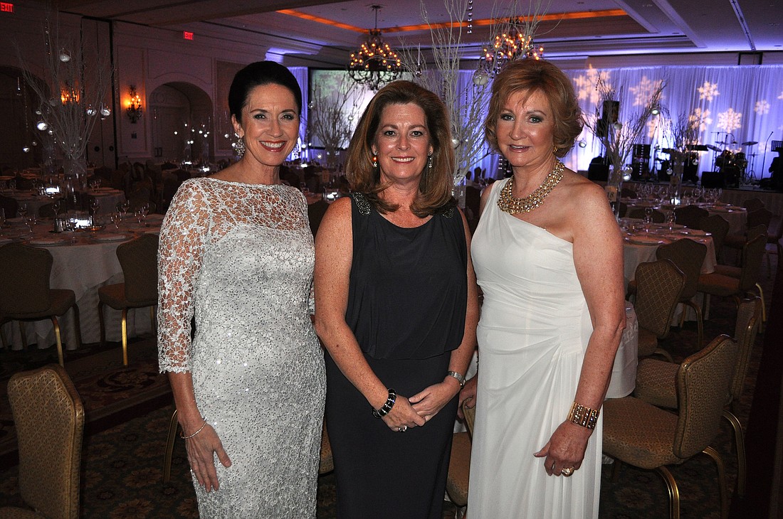 Mary Kenealy-Barbetta, Julie Delaney and Bridget Spiess at Catholic Charities Ball in 2013.