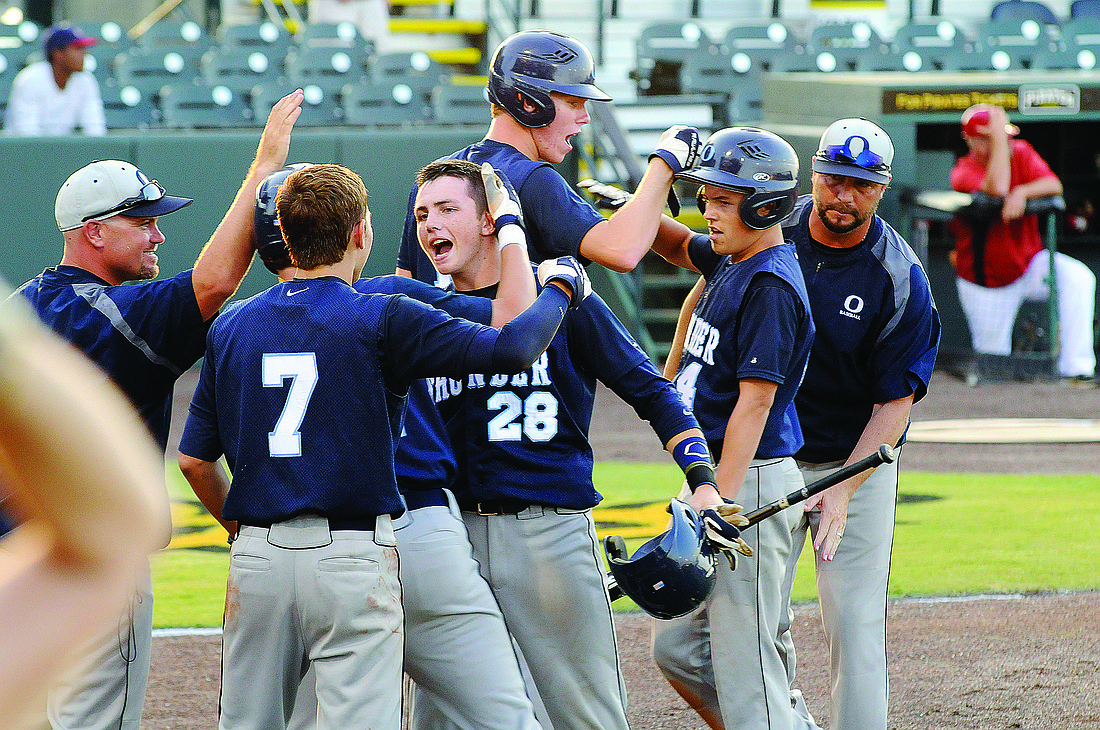 The Out-of-Door Academy baseball team celebrated its first district title since 2011 with an 11-3 victory over rival Cardinal Mooney in the Class 3A-District 10 championship April 26.