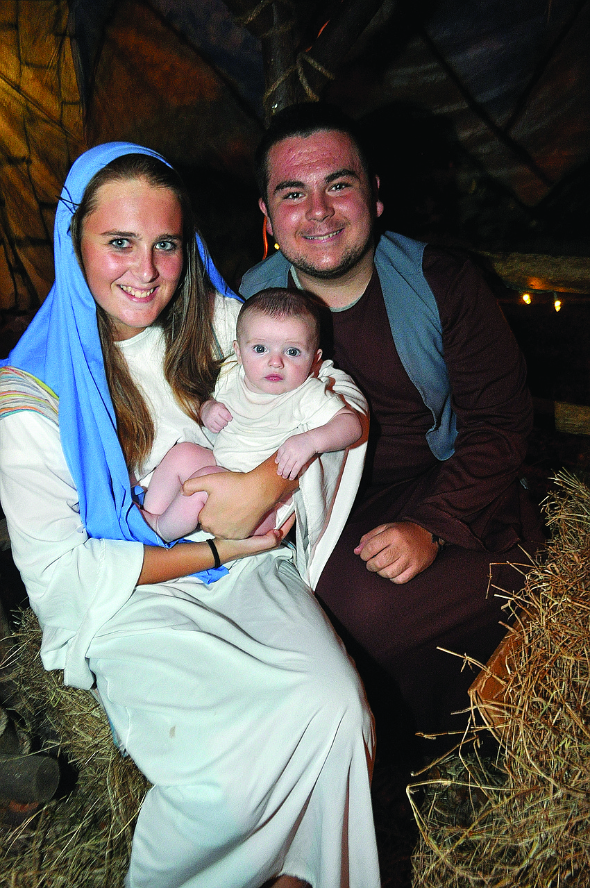 Meghan Neu, Ryan Hitchcock, 3 months, and Danny Riordan play Mary, baby Jesus and Joseph at Living Lord Lutheranâ€™s Church annual 