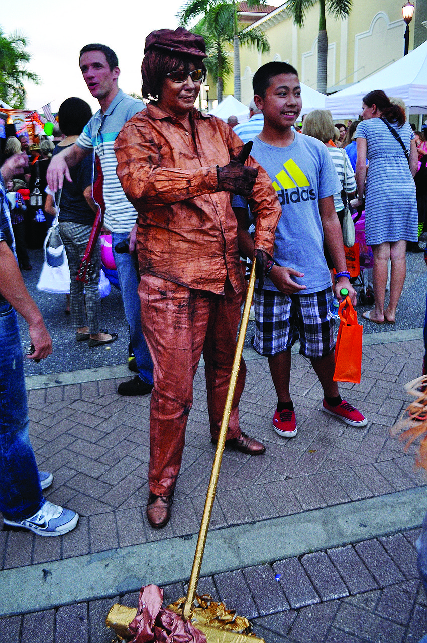 Fran Gott dresses as a bronze statue, called 