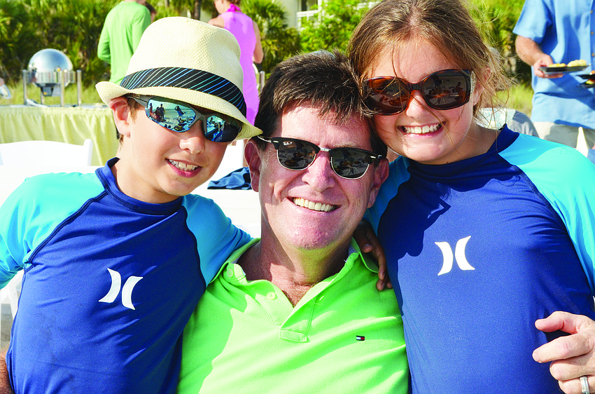 Christian and Caroline Corcoran celebrate Father's Day with their dad, Joe, June 16 at the Resort at Longboat Key Club