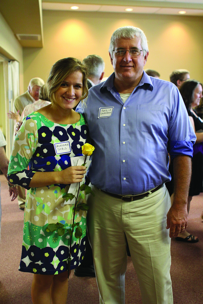 Longboat Key native Savannah Schield, with her dad, Steve, is one of 18 students who received scholarships from Longboat Island Chapel May 12.