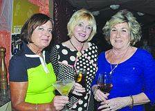 Jan Haynes, Nancy Vercauteren and Judy Heath raise their glasses April 3, at Restaurant Le Colonne, at a gathering of the Armalido Martini Club.