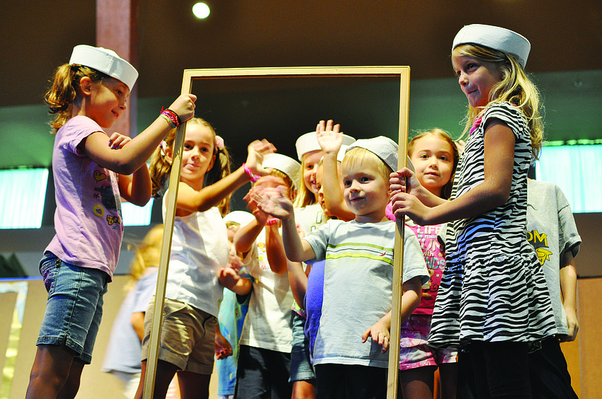 Children act out a living museum exhibit during Harvest United Methodist Church's Music and Drama Camp Aug. 2