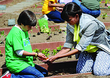 Emilio Vega, an 11-year-old Gullett Elementary School student from Colombia, was one of two students chosen to work side-by-side with first lady Michelle Obama as she planted a garden at the White House April 4.