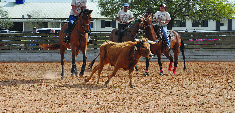 Julia Schroeder, Eddie Martinez and Paula Scott, of Team Polo Grill and Bar, compete in the SMR Cup Feb. 22 through Feb. 24. 2