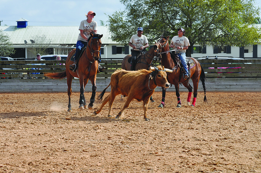 Julia Schroeder, Eddie Martinez and Paula Scott, of Team Polo Grill and Bar, compete in the SMR Cup Feb. 22 through Feb. 24. 2