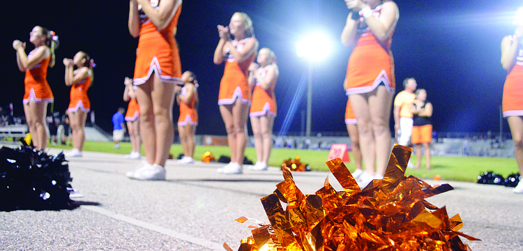Sarasota High School cheerleaders energize their classmates Aug. 23, at the Sarasota vs. Dixie Hollins football game.