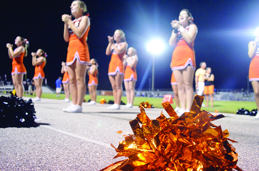 Sarasota High School cheerleaders energize their classmates Aug. 23, at the Sarasota vs. Dixie Hollins football game.