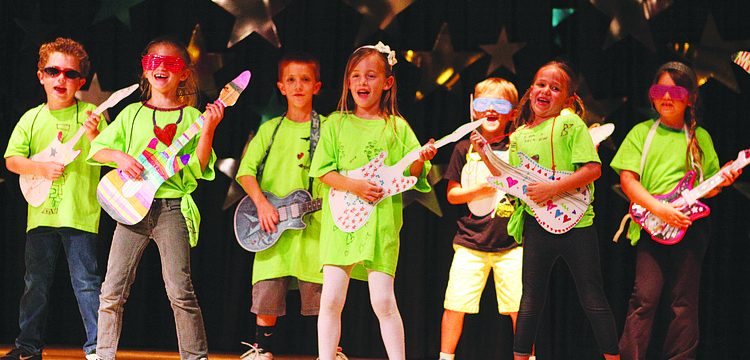 Cathy Lankenau's first-grade class performs "Summarize a Story" May 7 in Southside Elementary School's variety show.