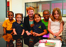 Incoming Girls Inc. Executive Director Robin Rose sits with several of the Girls Inc. girls in April. Rose joined Girls Inc. in August.