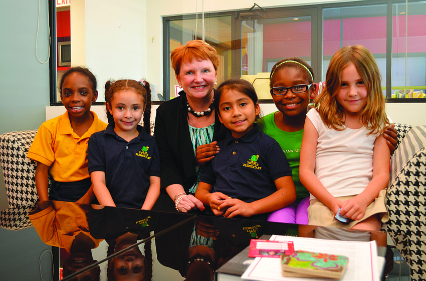 Incoming Girls Inc. Executive Director Robin Rose sits with several of the Girls Inc. girls in April. Rose joined Girls Inc. in August.