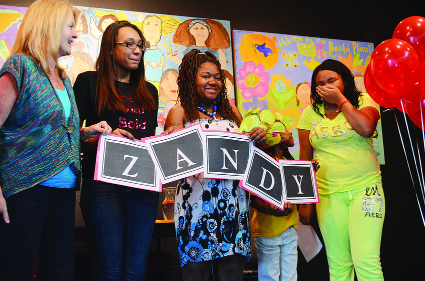Dr. Myra McPherson, 2012 Girl of the Year Shayla Brown, Shakeyla Dozier, Shaiya Dozier and Zandy Sanders Jan. 11 during the surprise reception for Zandy.
