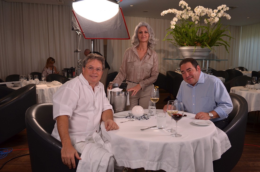 Chef Jose Martinez and his wife, Victoria, with celebrity chef Emeril Lagasse during the September filming of 'Coming to America.' (File photo)