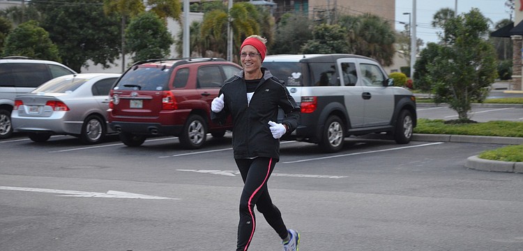Nancy Downs races to the finish line.