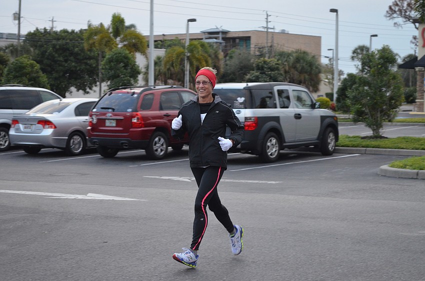 Nancy Downs races to the finish line.