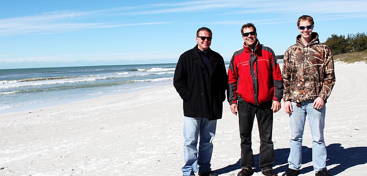Eric Hillman, Greg Albrecht and Jordan Albrecht braved the cold Tuesday, Jan. 7, for an afternoon walk on the beach.