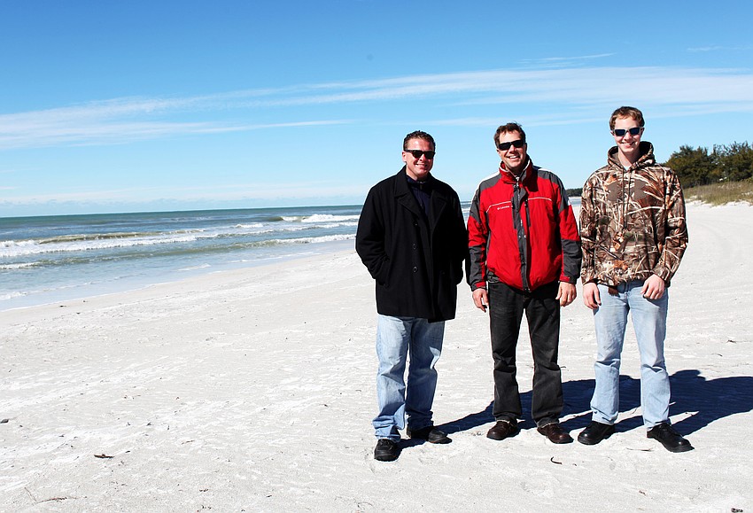 Eric Hillman, Greg Albrecht and Jordan Albrecht braved the cold Tuesday, Jan. 7, for an afternoon walk on the beach.