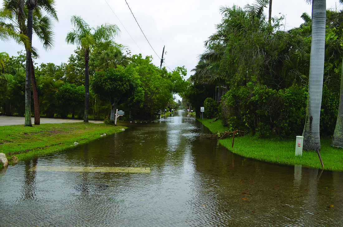 File photo. Tropical Storm Andrea caused flooding problems in June in neighborhoods like Longbeach Village and Sleepy Lagoon. Rising flood insurance premiums have Longboat Key residents concerned.
