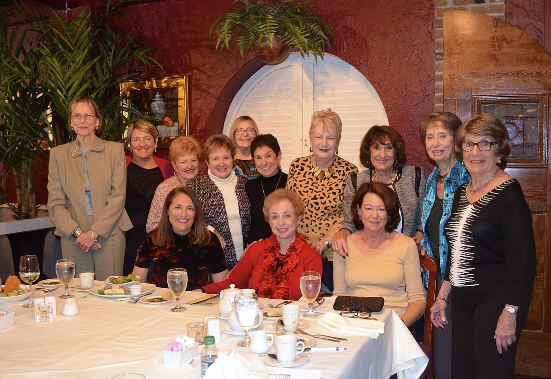 Beverly Peterman, seated, center, celebrates with her book club.
