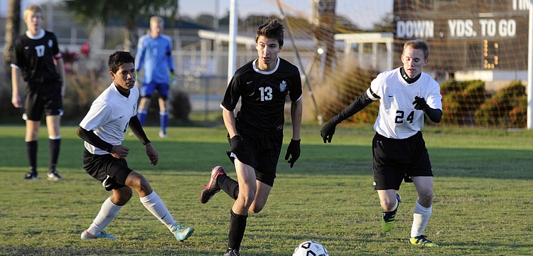 Braden River junior defender Alex Cook maneuvers the ball up the field during the Pirates 1-0 loss to rival Lakewood Ranch Jan. 7.
