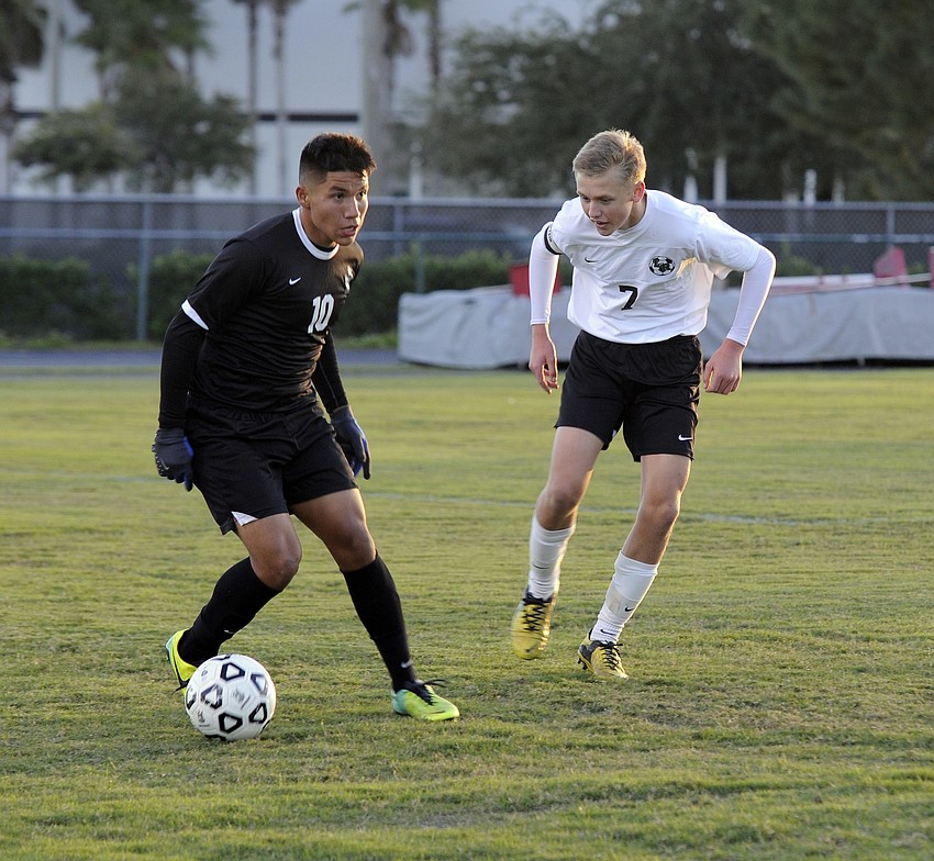 Braden River midfielder Hector Perez looks to pass the ball to an open teammate.