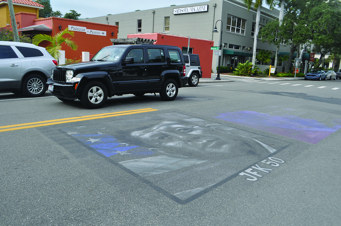 Works from the Chalk Festival, such as this drawing near Dolphin Street, have not yet been cleaned from the road.