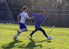 Sarasota Christianâ€™s Lane Chupp looks to maintain possession away from Eagles forward Brendon Durmody.
