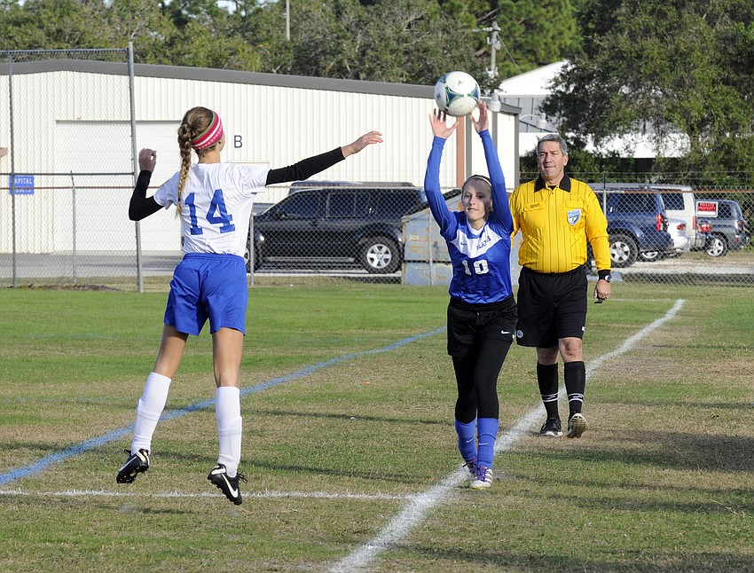 Sarasota Christianâ€™s Emma Kral throws the ball back into play.