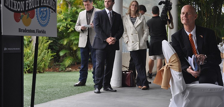 Gov. Rick Scott followed along to the Mixonâ€™s presentation.