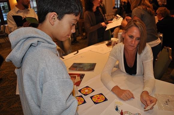 Brayan Dasilva played a math game with Jana Espy of the Calvary Chapel School in Sarasota at last year's event.