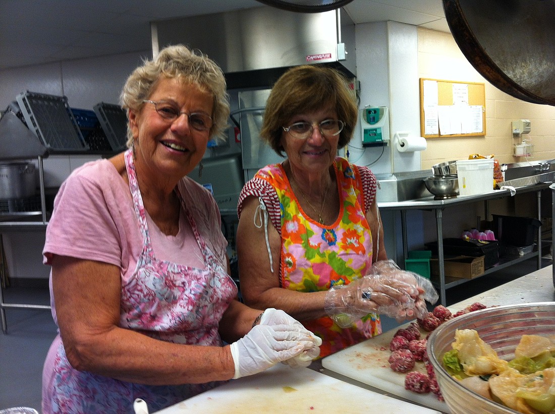 Diane Silverstein and Shirley Rose make cabbage rolls for the Sarasota Jewish Food Festival at Temple Sinai
