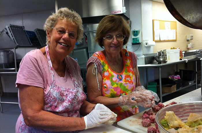 Diane Silverstein and Shirley Rose make cabbage rolls for the Sarasota Jewish Food Festival at Temple Sinai