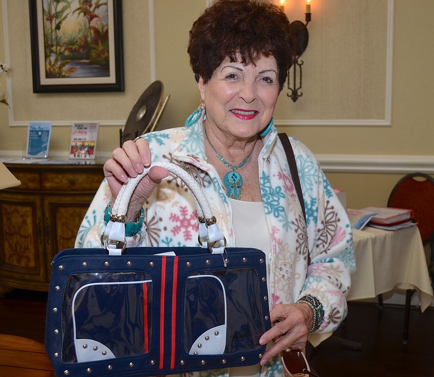 Emmy Schmidt shows off a bag she is about to part ways with later.