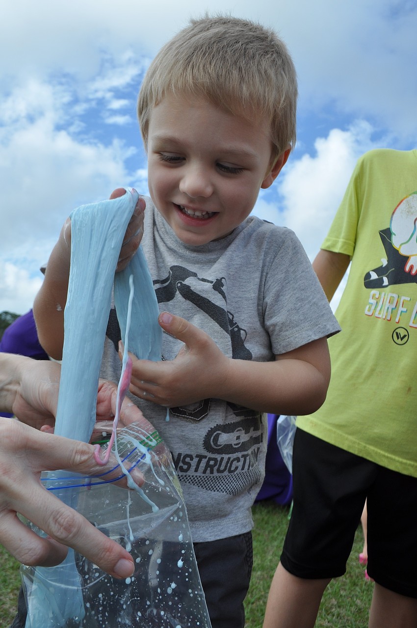GreyHawk's Sebastian Lemke, 3, feels slime for the first time.