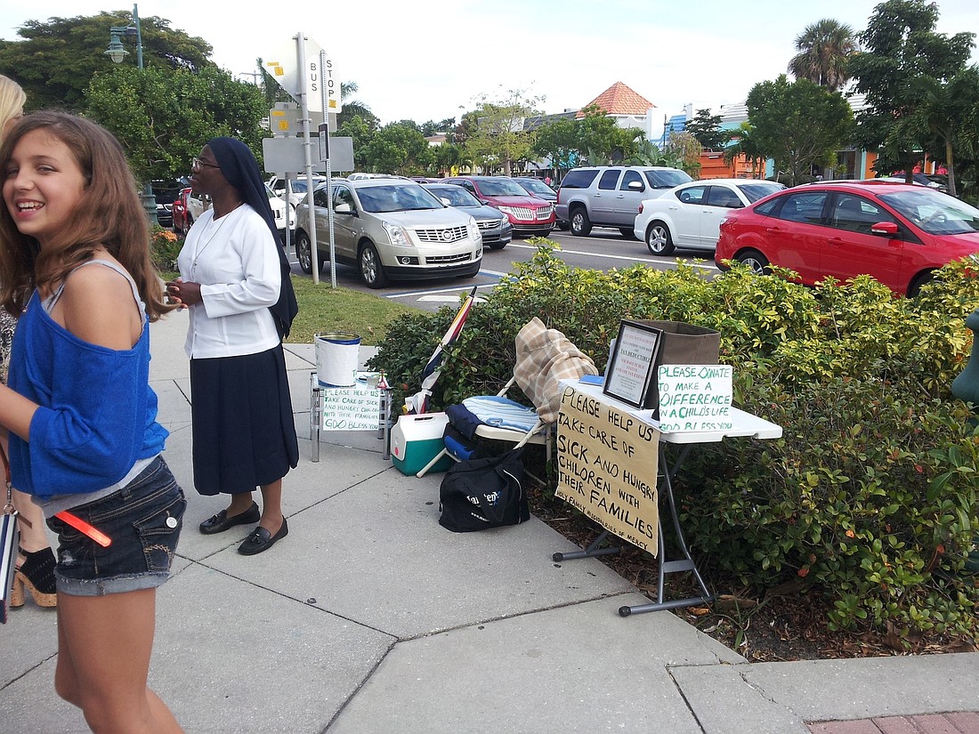 A woman soliciting donations on St. Armands Circle is upsetting merchants and has BID board members worried it's causing a problem for the popular shopping destination. (Courtesy photo)