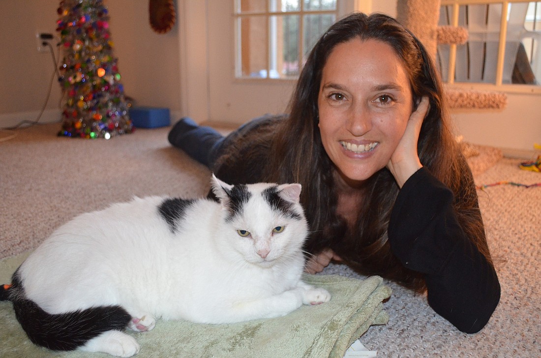 Sara Goldenthal sits with Panda at her home in Palmer Ranch.