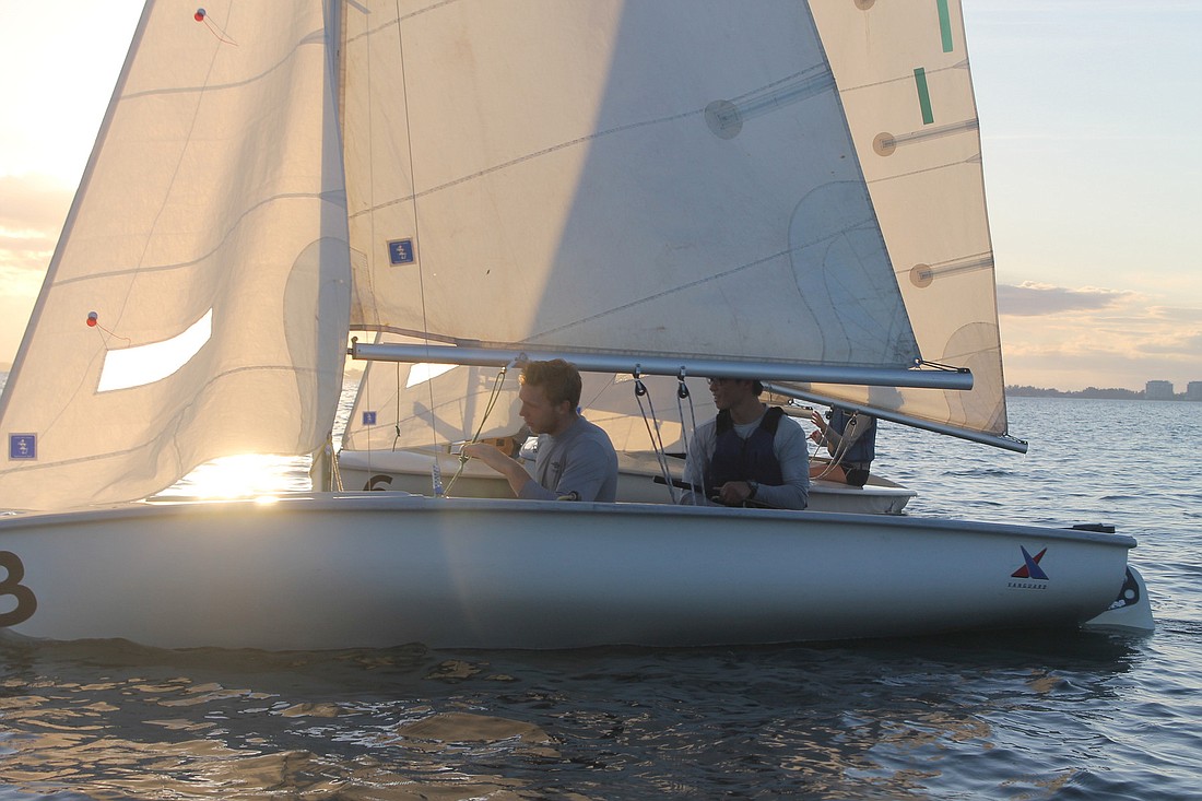 Courtesy photo. Michael Long sails with fellow sailing instructor C.J. Lee.