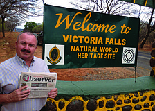 NATURAL FIT. Longboat Key resident Ernie Goffi caught up on his Sarasota Observer news while on a trip to Victoria Falls, Zimbabwe.