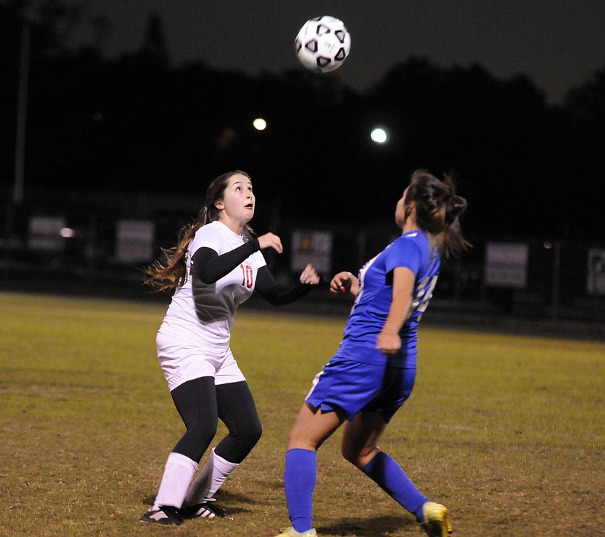 Cardinal Mooney junior Jill Polk goes up for a header in the first half of the Class 2A-District 11 championship Jan. 16.