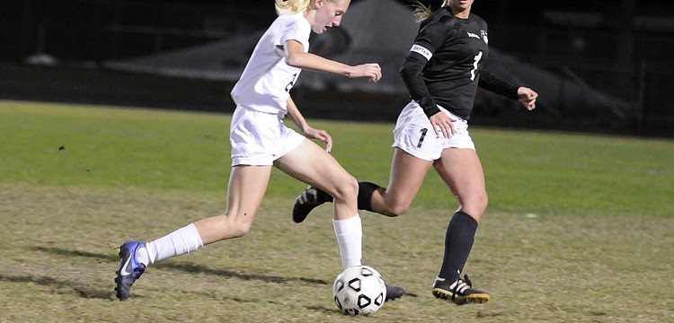 Lakewood Ranch High freshman Sophia Falco, left, scored a pair of goals for the Lady Mustangs.