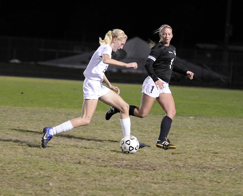 Lakewood Ranch High freshman Sophia Falco, left, scored a pair of goals for the Lady Mustangs.