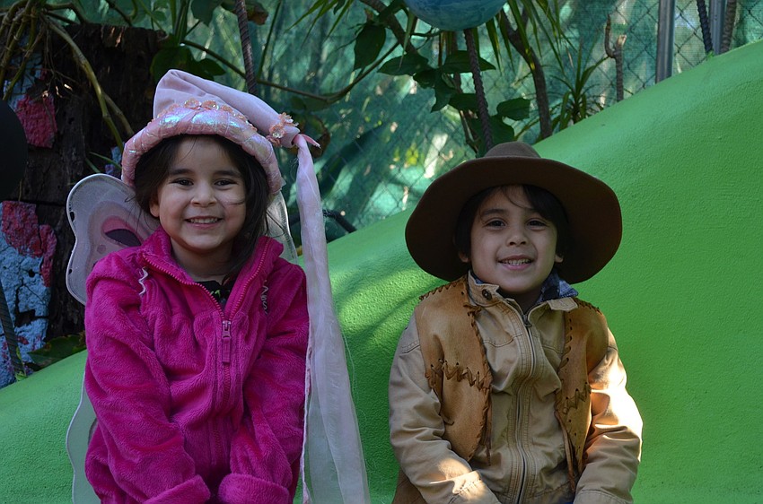 Simone Velez was a butterfly princess while Cristian Anumada spent the day as a cowboy.