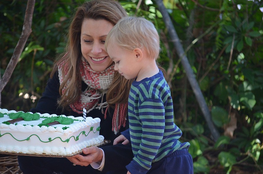 Samuel Zoller blows out the candles