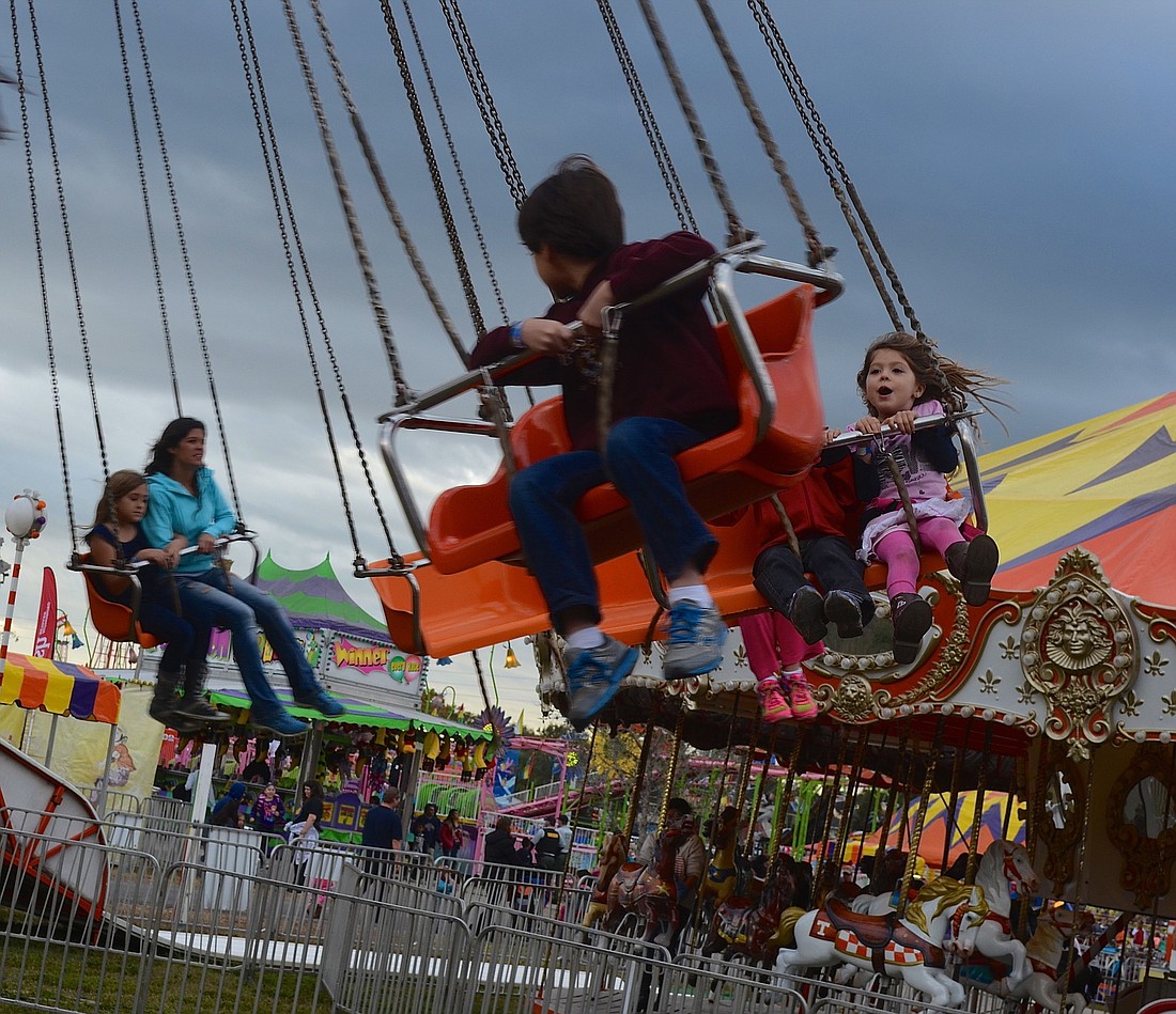 The fair's attractions include a spinning swing ride.