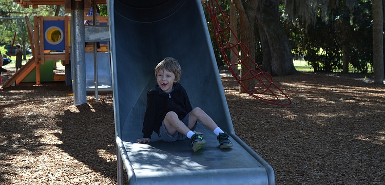 Ezra Keim, 5, enjoys his day off at the playspace. "I've been sliding for five years and I'm really good at it," he says. "This slide is the best."