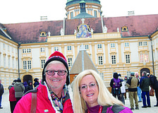 RIVER RENDEZVOUS. East County residents Chic and Robin Hansen read their East County Observer in front of the Melk Abbey along the Danube River in Austria. The couple enjoyed a riverboat cruise from Nuremberg, Germany, to Vienna.